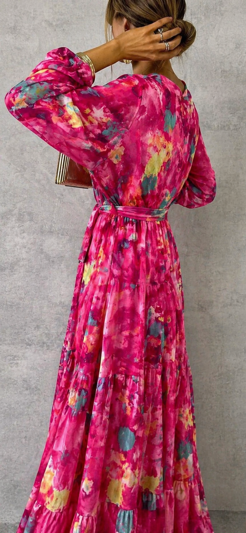 Elegant floral wrap dress for women by FJØRNA, showcasing a stylish and feminine design with vibrant flower patterns.
