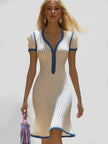 FJØRNA casual knitted V-neck dress for women, featuring a soft, comfortable design with long sleeves and a relaxed fit.