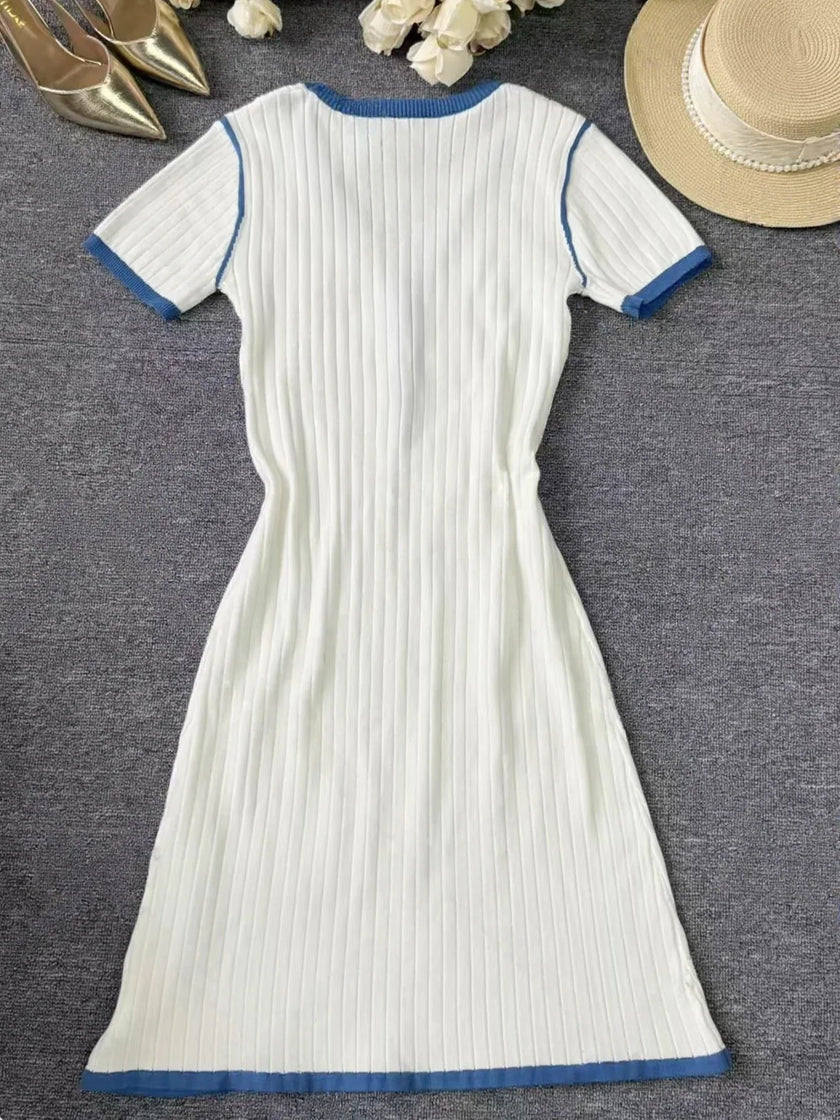 FJØRNA casual knitted V-neck dress for women, featuring a soft, cozy fabric and a stylish V-neckline, perfect for everyday wear.