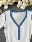 FJØRNA casual knitted V-neck dress for women, featuring a soft, cozy texture and a relaxed fit, perfect for everyday wear.