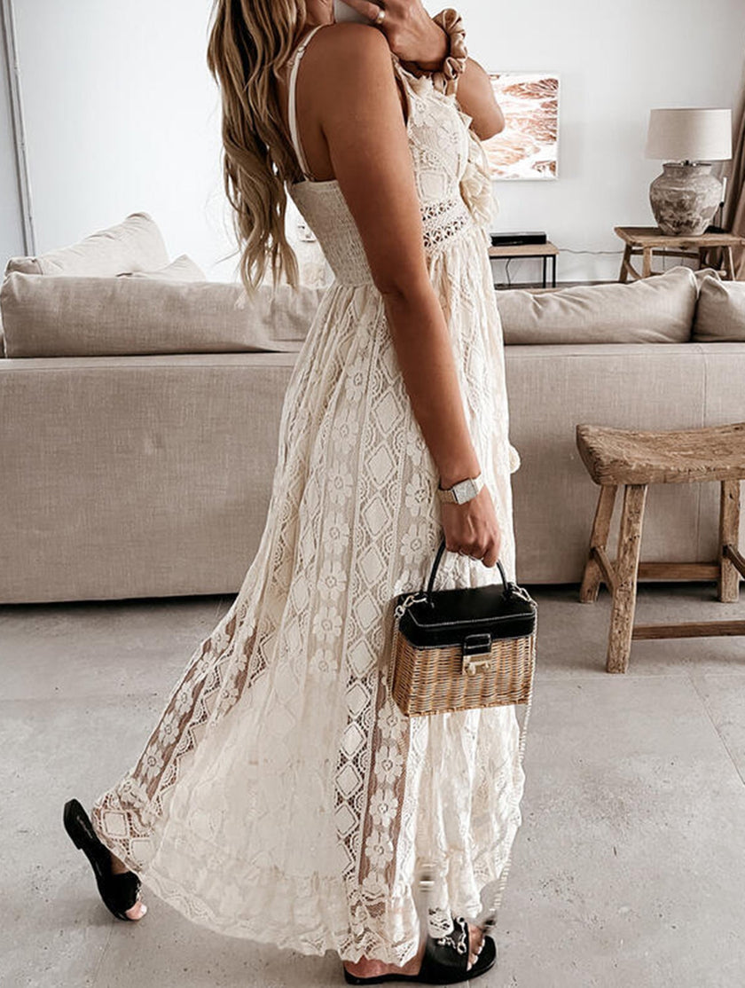 White lace strappy long dress by FJØRNA featuring resort-style design and elegant flowy fabric.