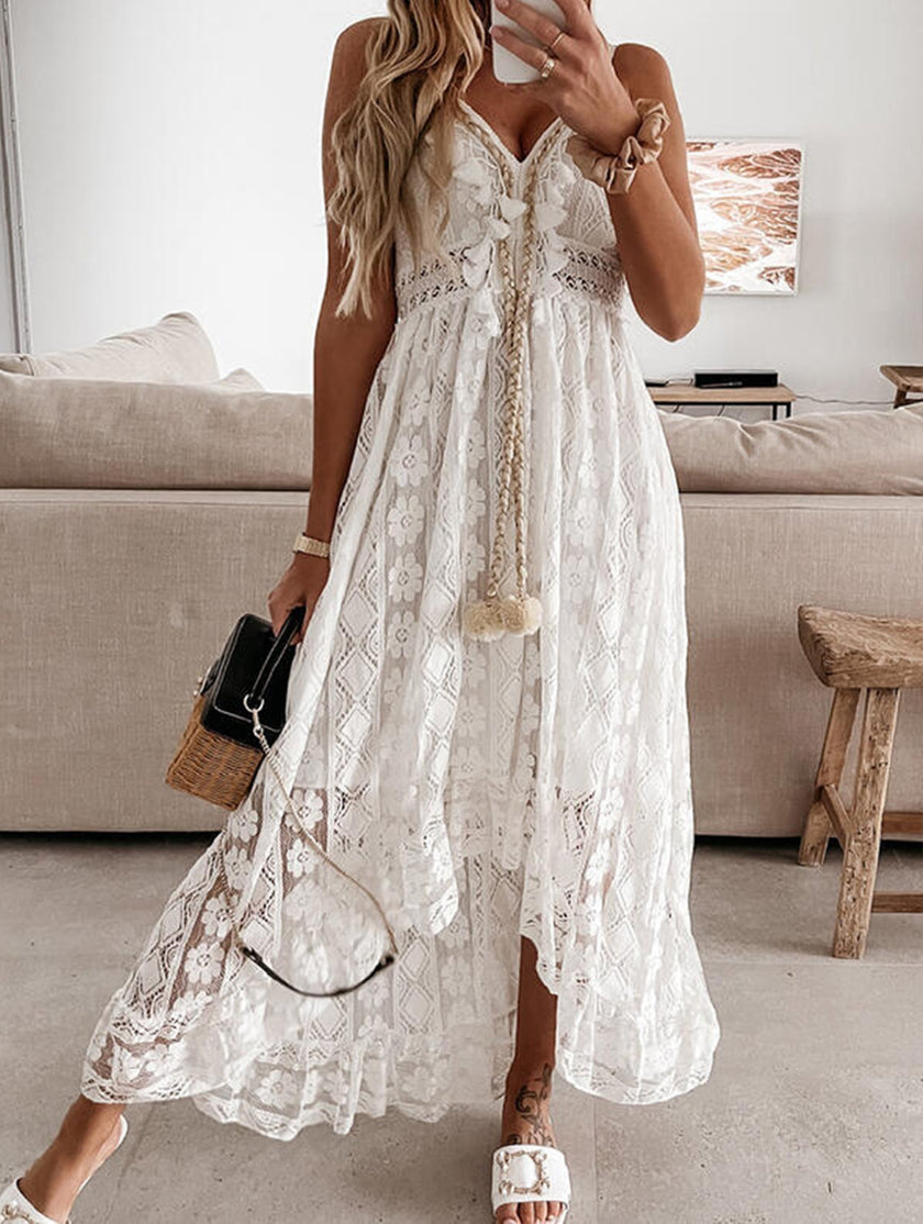 White lace strappy long dress by FJØRNA featuring resort-style design and elegant flowy fabric, perfect for summer or special occasions.
