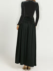 Black retro deep V long sleeve maxi dress by FJØRNA, featuring a flowing silhouette and elegant design.