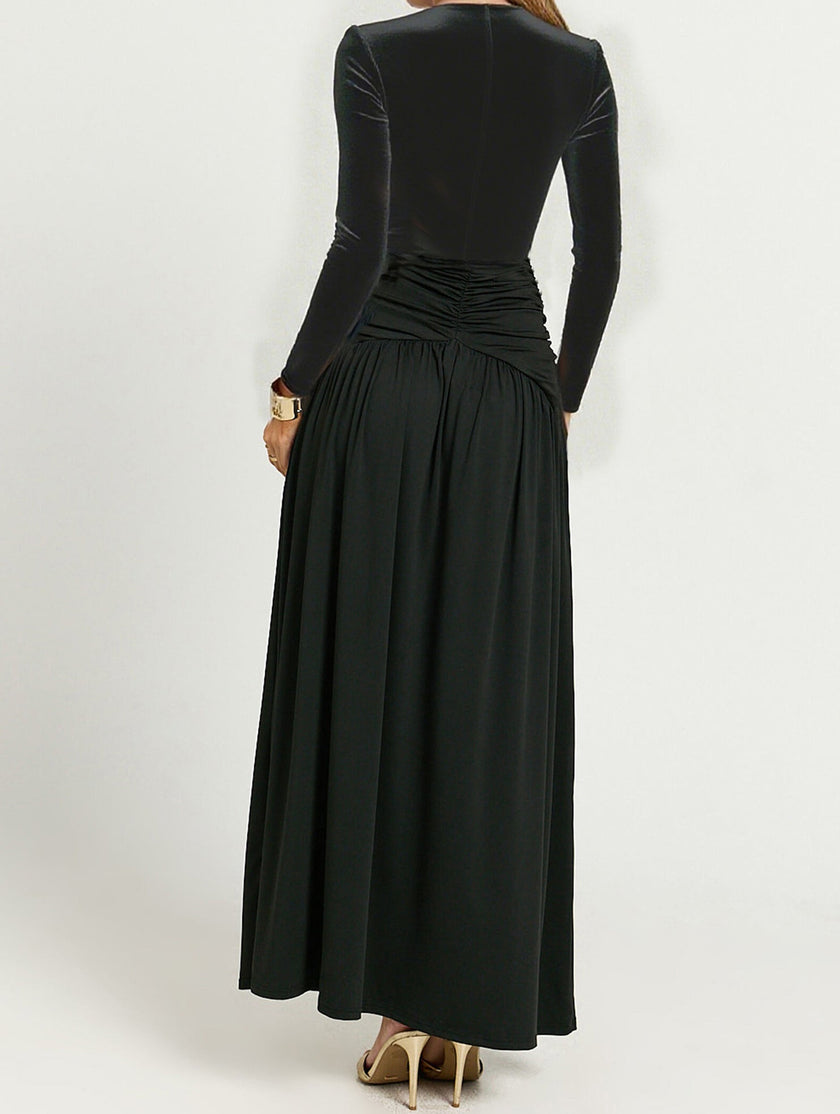 Black retro deep V long sleeve maxi dress by FJØRNA, featuring a flowing silhouette and elegant design.