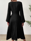 FJØRNA fashionable white V-neck lantern long-sleeved dress, showcasing its elegant design and flowing fabric.
