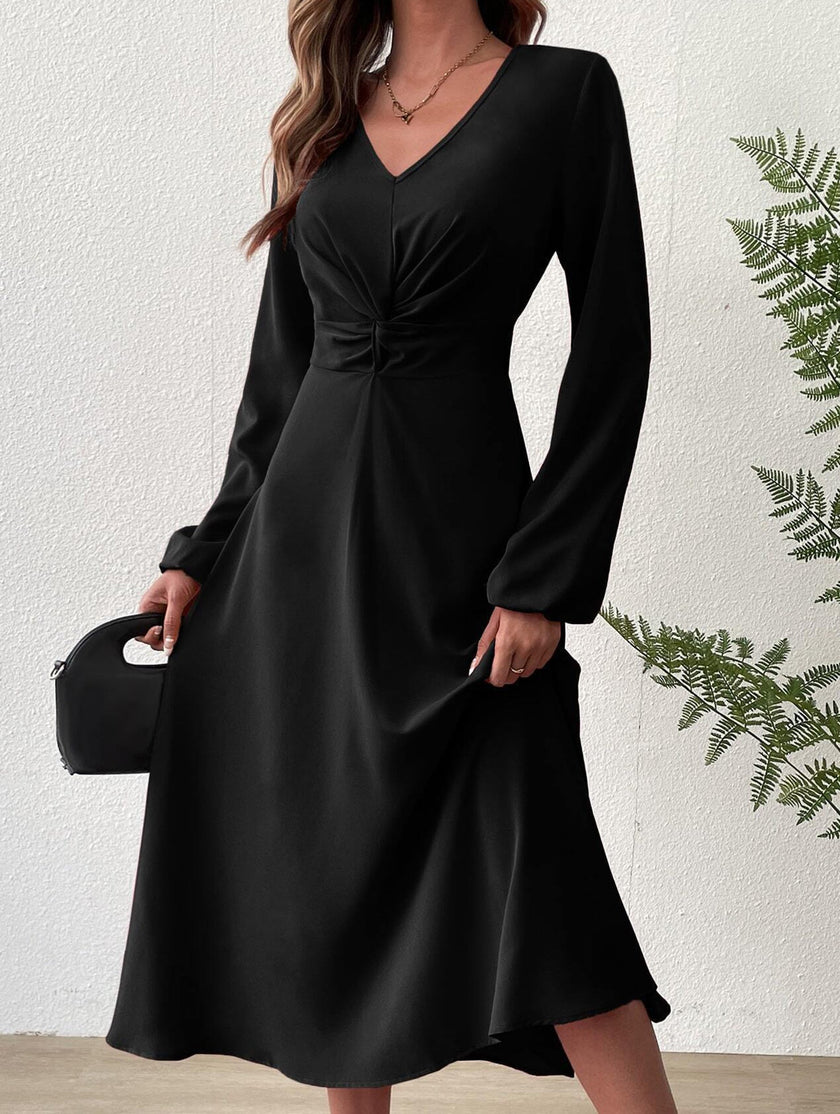 Black V-neck lantern long-sleeved dress by FJØRNA, featuring a stylish silhouette and elegant design.