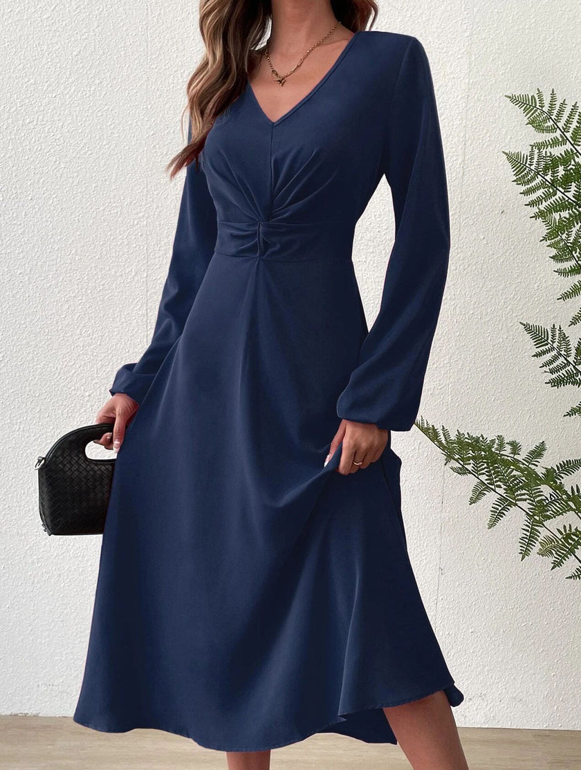 FJØRNA white V-neck lantern long-sleeved dress, stylish and elegant, displayed on a mannequin with a flowing silhouette.
