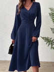 FJØRNA white V-neck lantern long-sleeved dress, stylish and elegant, shown on a model with a fitted waist and flowing skirt.