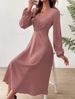 White V-neck lantern long-sleeved dress by FJØRNA, showcasing a flowing silhouette and elegant design.