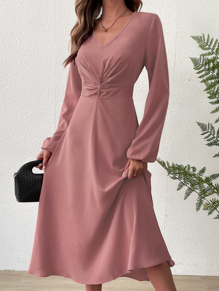 White V-neck lantern long-sleeved dress by FJØRNA, featuring flowing fabric and a stylish, elegant silhouette.
