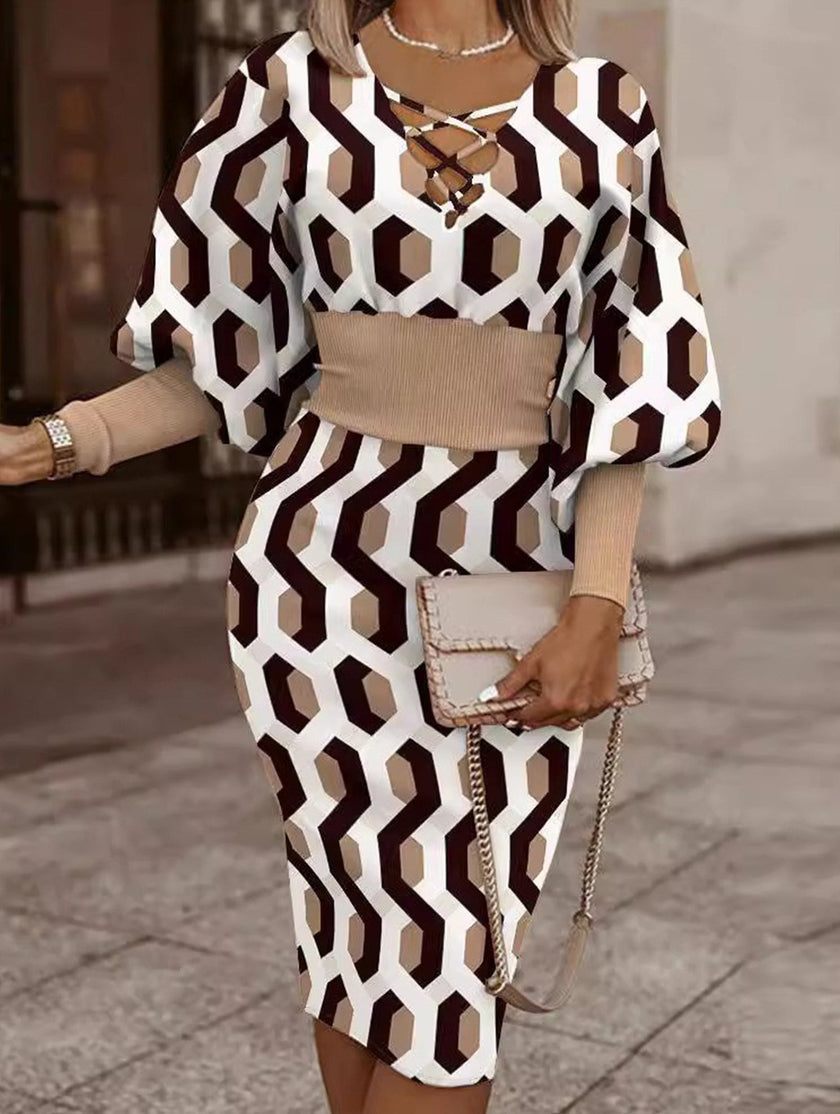 White waist-hugging V-neck dress by FJØRNA, featuring a fitted silhouette and elegant design, shown on a model.