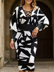 White waist-hugging V-neck dress by FJØRNA, showcasing a fitted silhouette and elegant design perfect for stylish occasions