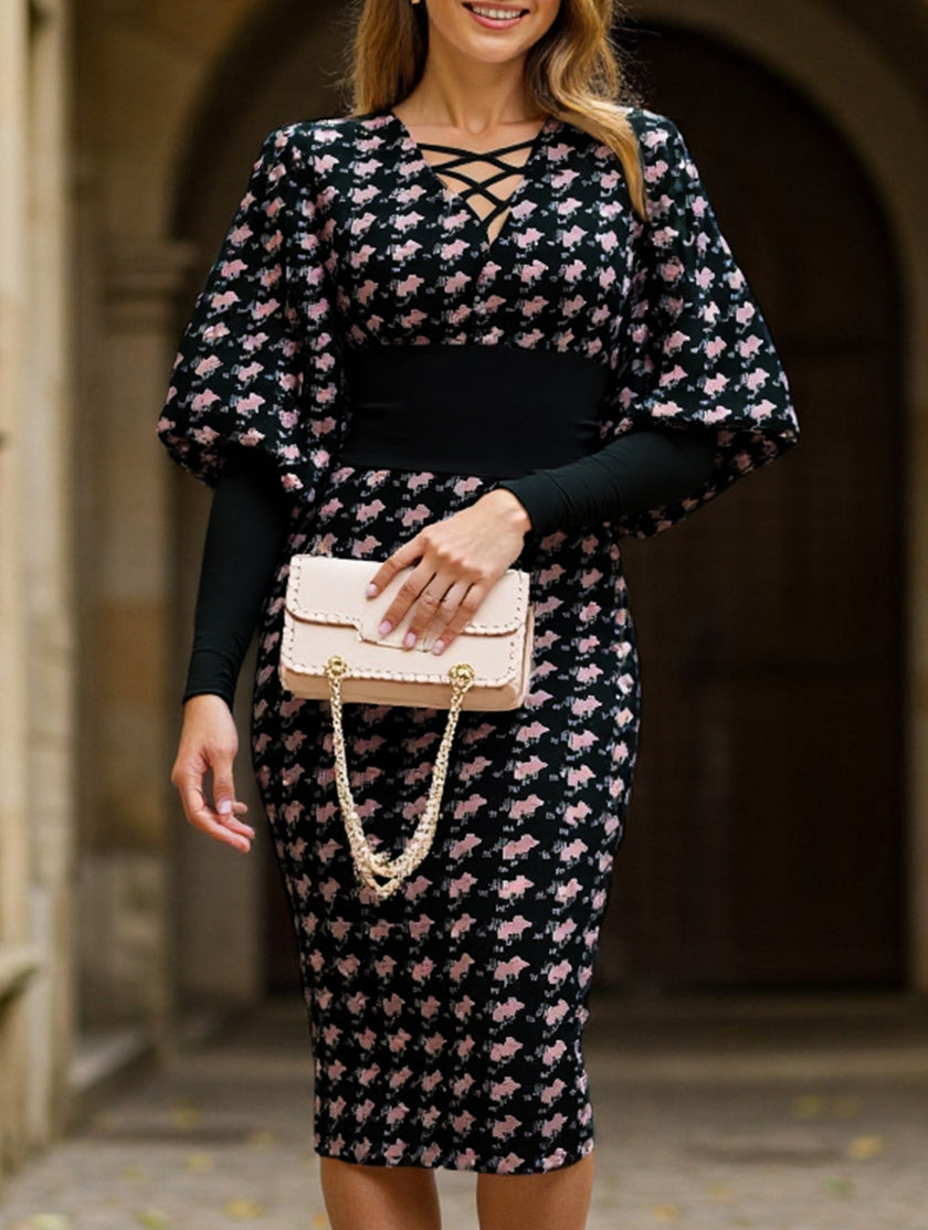 White waist-hugging V-neck dress by FJØRNA, showing a fitted silhouette and elegant design.