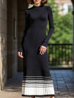 FJØRNA black and white striped pleated sweater dress featuring a fitted silhouette and stylish knee-length design.