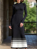 FJØRNA black and white striped pleated sweater dress featuring a fitted silhouette and stylish knee-length design.
