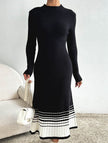 FJØRNA black and white striped pleated sweater dress, long-sleeve with a fitted silhouette, styled for casual or dressy occasions.