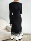 FJØRNA black and white striped pleated sweater dress, casual long-sleeve dress with a fitted waist and classic pattern.