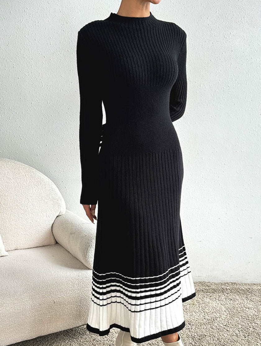FJØRNA black and white striped pleated sweater dress, casual long-sleeve dress with a fitted waist and classic pattern.