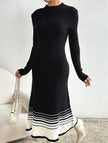 FJØRNA black and white striped pleated sweater dress, knee-length with long sleeves, stylish and cozy for casual wear.