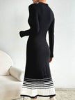 FJØRNA black and white striped pleated sweater dress, stylish and cozy, featuring a classic pattern and knee-length design.
