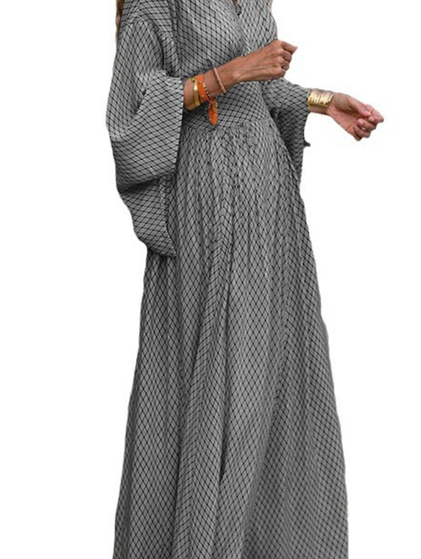 FJØRNA floral loose V-neck waist dress in white, showcasing its relaxed fit and elegant design on a model.