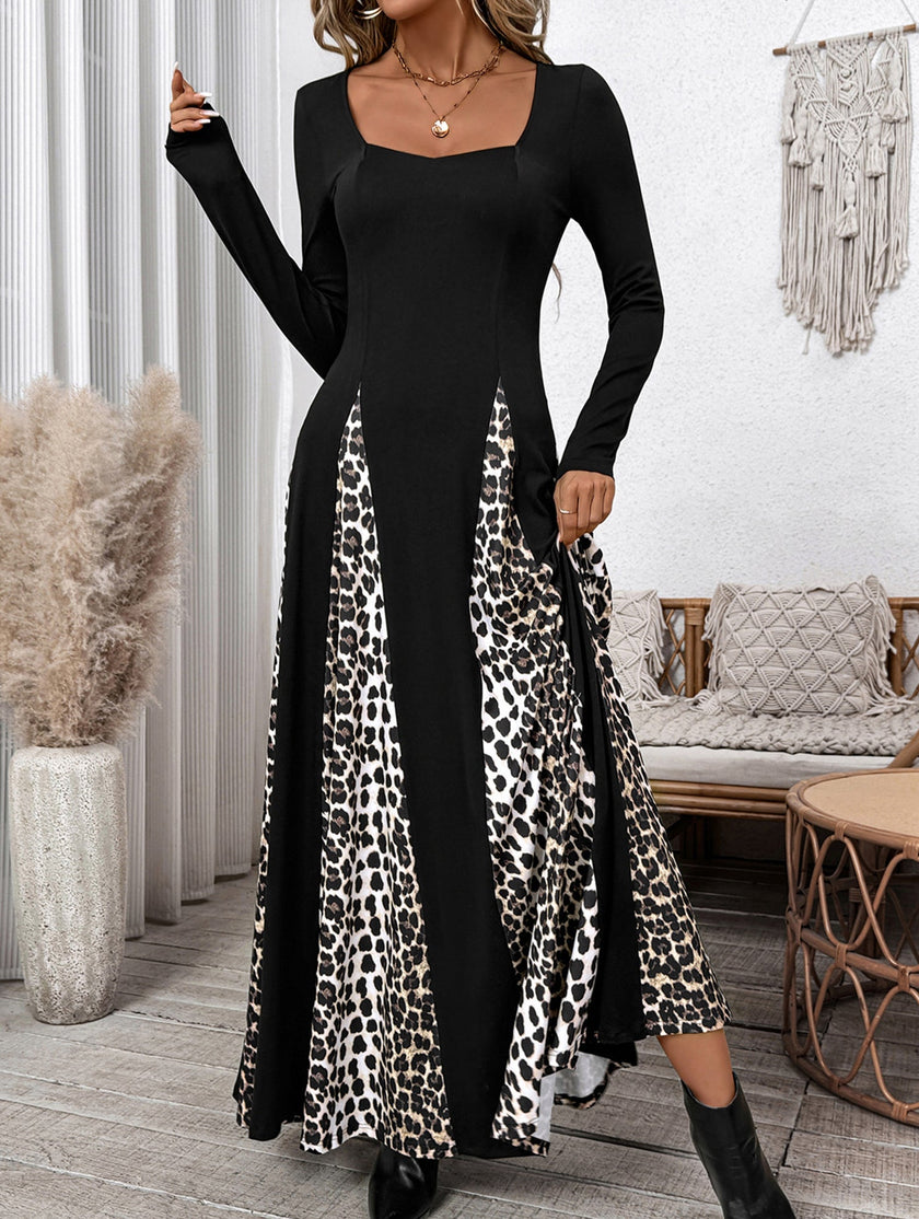 FJØRNA retro high waist leopard print patchwork dress with long sleeves and fitted silhouette, black background with bold pattern.