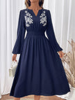 Light blue embroidered waist V-neck dress by FJØRNA, featuring a flattering fit and intricate embroidery details.