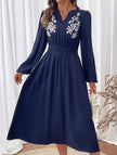 Light blue embroidered waist V-neck dress by FJØRNA, showcasing intricate embroidery and elegant design.