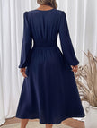 Light blue embroidered waist V-neck dress by FJØRNA, showcasing intricate embroidery and elegant design.