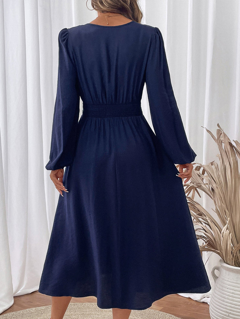 Light blue embroidered waist V-neck dress by FJØRNA, showcasing intricate embroidery and elegant design.