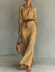White FJØRNA solid color irregular pleated dress hanging on a mannequin with a flowing, stylish design.