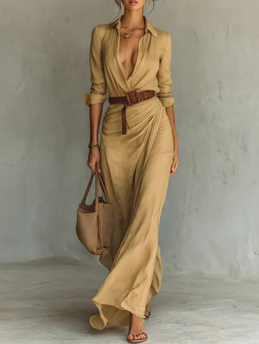 White FJØRNA solid color irregular pleated dress hanging on a mannequin with a flowing, stylish design.