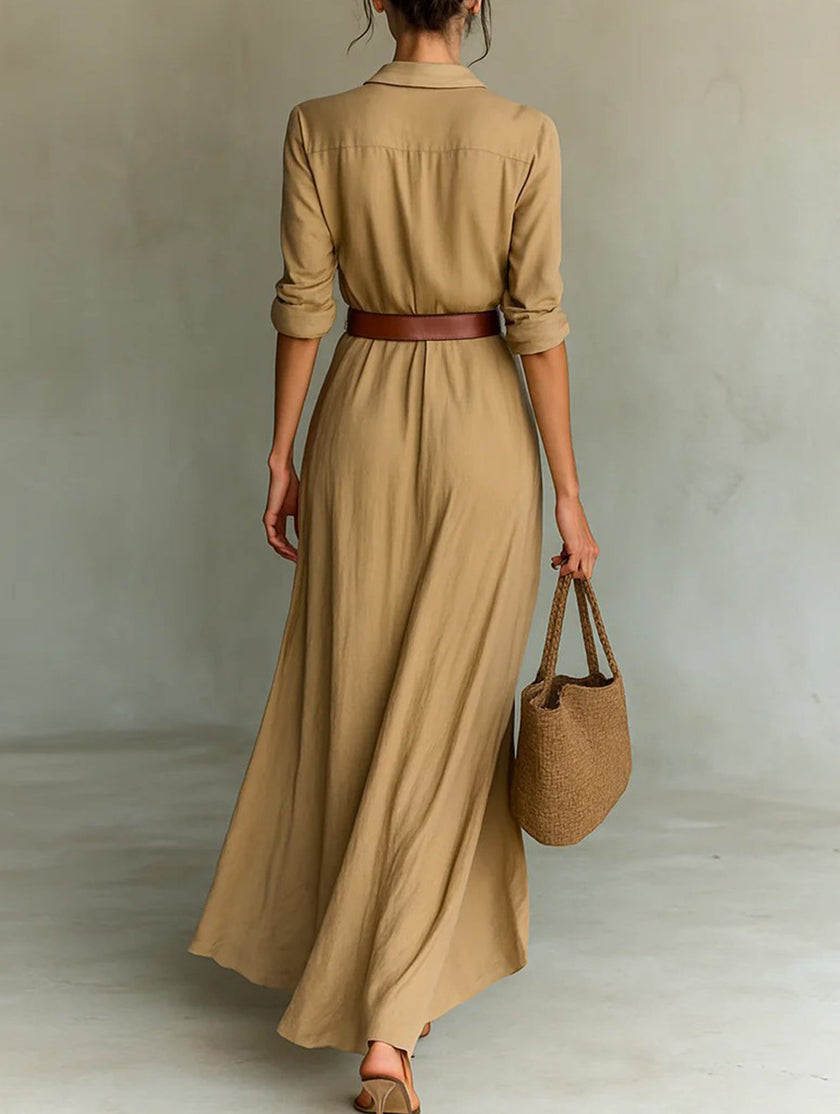 White FJØRNA solid color irregular pleated dress with flowing fabric and unique asymmetrical design.