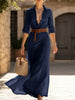 Navy solid color irregular pleated dress by FJØRNA, featuring a flowing silhouette and unique pleated design.