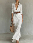 White FJØRNA solid color irregular pleated dress with flowing fabric and asymmetric hem, perfect for elegant occasions.