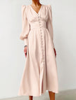 FJØRNA retro white V-neck waist dress with fitted silhouette, displayed on a mannequin in a stylish fashion setting.
