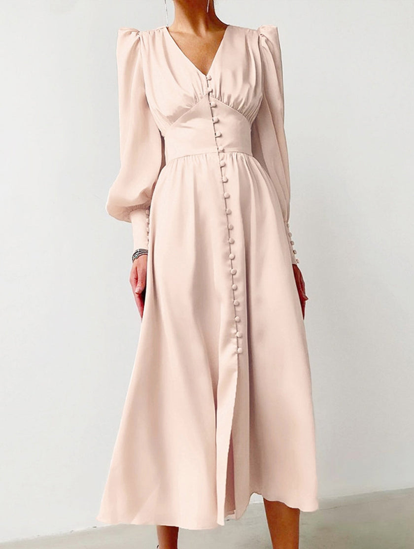 FJØRNA retro white V-neck waist dress with fitted silhouette, displayed on a mannequin in a stylish fashion setting.
