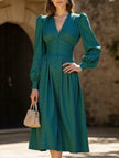 FJØRNA white retro V-neck waist dress displayed on a mannequin with a fitted silhouette and classic design.