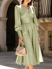 White retro V-neck waist dress by FJØRNA, featuring a fitted silhouette and classic design, shown on a model.