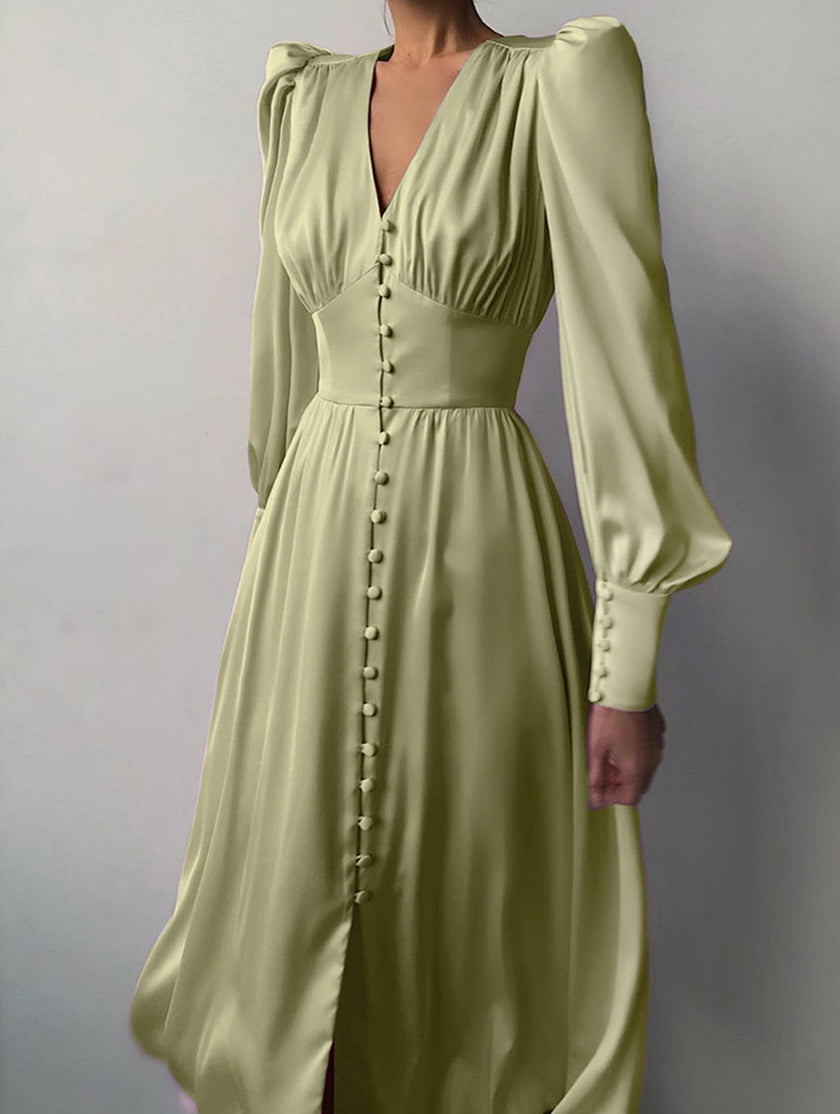 FJØRNA white retro V-neck waist dress hanging on a hanger, showcasing its classic design and clean fabric details.