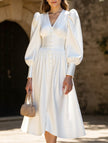 White retro V-neck waist dress by FJØRNA, showcasing a stylish vintage-inspired design with a fitted silhouette.