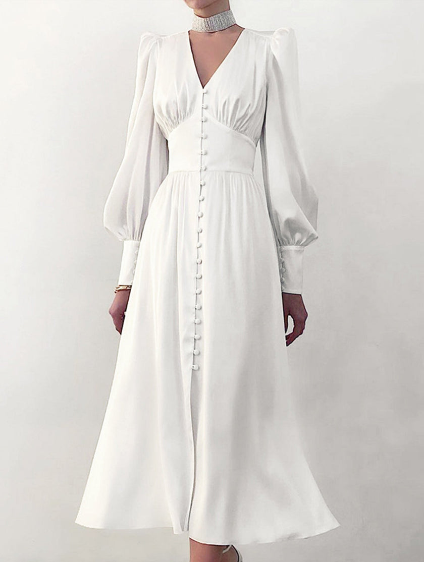 FJØRNA retro white V-neck waist dress, stylish and elegant, shown on a model with a fitted silhouette and classic design.