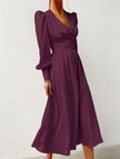 FJØRNA white retro V-neck waist dress displaying a fitted silhouette and classic design on a model.