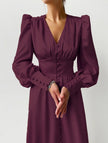 White retro V-neck waist dress by FJØRNA, featuring a fitted silhouette and classic design, displayed on a neutral background.