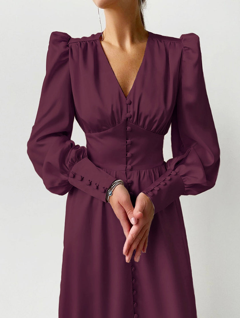 White retro V-neck waist dress by FJØRNA, featuring a fitted silhouette and classic design, displayed on a neutral background.