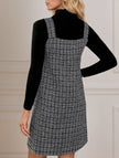 FJØRNA sleeveless black midi dress with suspenders and V-neck, showcasing a stylish, modern dress design.