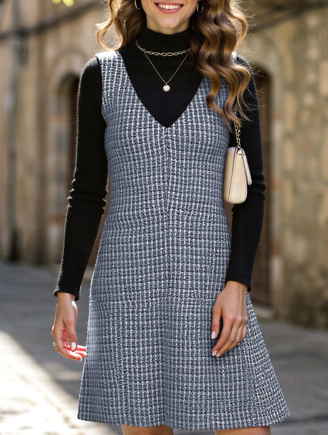 Blue FJØRNA sleeveless midi dress with suspenders and V-neck, stylish and elegant for casual or dressy occasions.