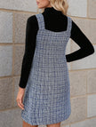 FJØRNA sleeveless white midi dress with suspenders and V-neck, shown on a model, perfect for casual or summer wear.