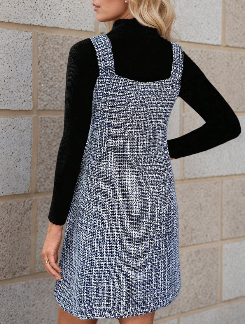FJØRNA sleeveless white midi dress with suspenders and V-neck, shown on a model, perfect for casual or summer wear.