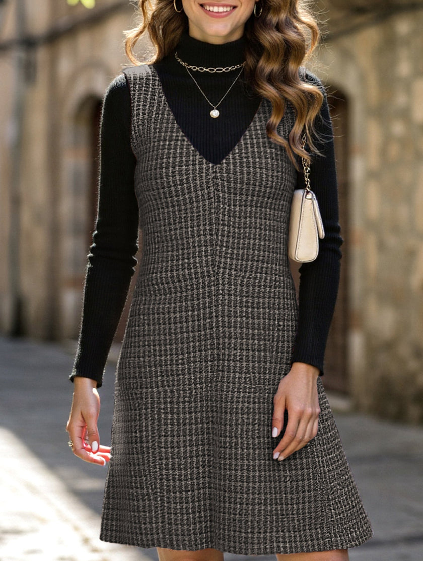 FJØRNA sleeveless white midi dress with suspenders and V-neck, shown on a model, stylish and modern for casual or semi-formal wear.